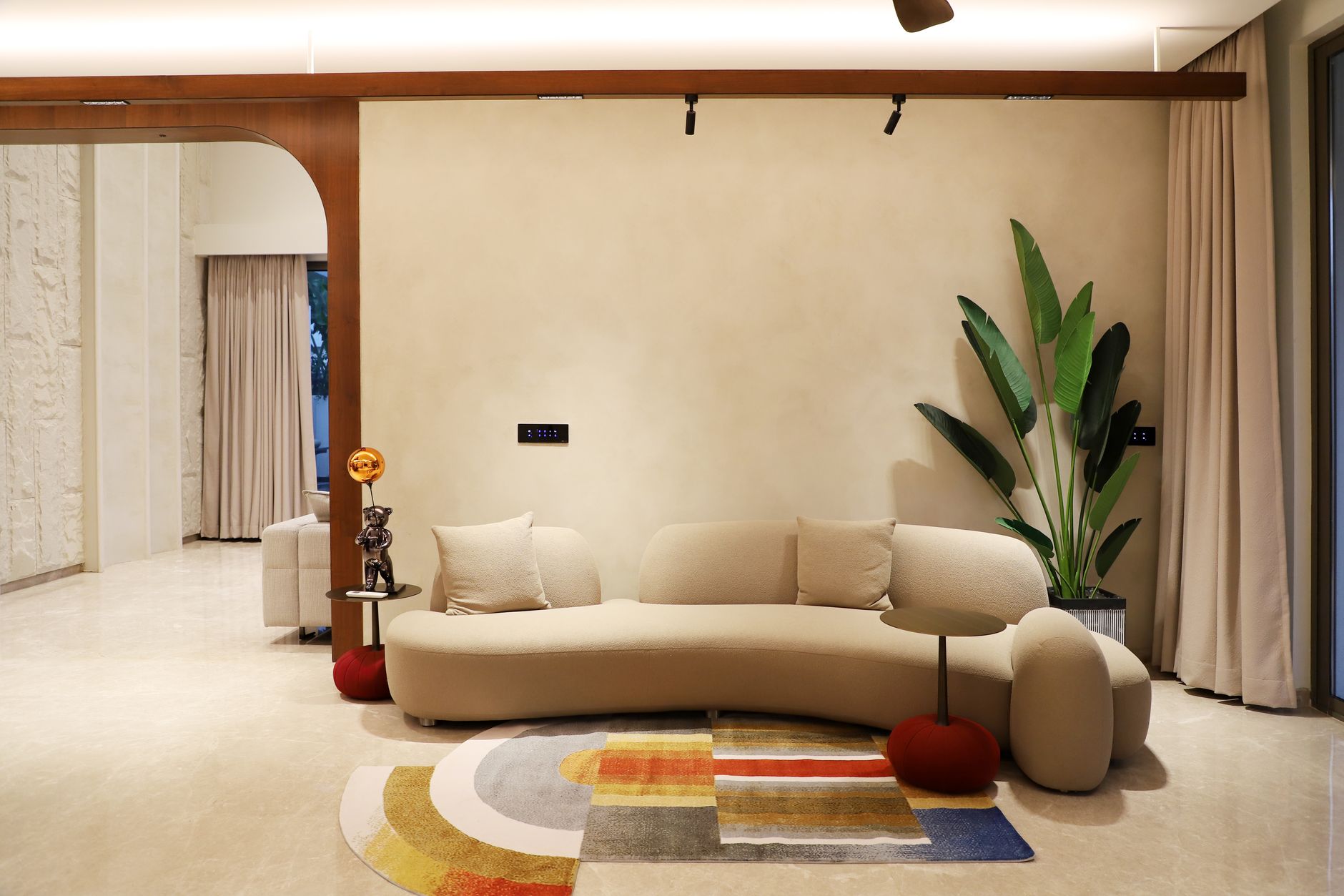 Warm family living room with curved sofa